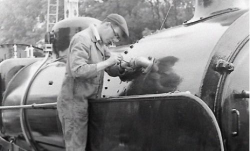 An engineer mending part of steam train (photo courtesy of The Mid Hants Railway Watercress Line)